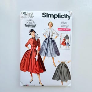 May include: A Simplicity S9882 sewing pattern envelope for 1950s vintage clothing. The white paper packaging features illustrations of a red dress, a white jacket with a patterned skirt, and a dark skirt. Text includes Simplicity, 1950s Vintage, and S9882.