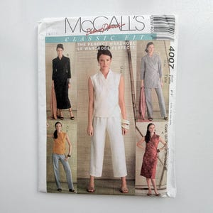 May include: A McCall's 4007 sewing pattern envelope featuring illustrations of various wrap-style garments including a long black dress, a sleeveless white top with matching trousers, a grey jacket with trousers, and a patterned red dress.