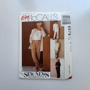 May include: A vintage McCall's sewing pattern, featuring a woman in a blazer and striped pants. The pattern includes options for tops and bottoms. The cover has the text "Easy McCall's" and "Sew News". Size B (8,10,12).