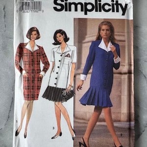 May include: Simplicity sewing pattern 7608. The pattern features illustrations of three different outfits: a red plaid dress, a white dress with a black pleated skirt, and a blue dress with a pleated hem. The pattern size is 12-16.