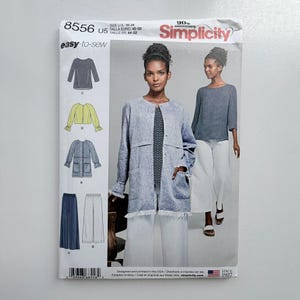 May include: Simplicity sewing pattern 8556 for sizes 16-24. The envelope features illustrations of tops, jackets, and wide-leg trousers. A central photograph displays a blue linen-look jacket with a frayed hem and patch pockets worn over a patterned top.