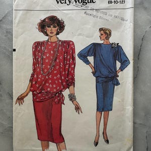 May include: Vintage Very Easy Very Vogue pattern 9314. The pattern features illustrations of two different dresses. One dress is red with white accents, and the other is blue. The pattern size is 8-10-12.