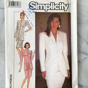 May include: A vintage Simplicity sewing pattern packet showing a woman in a white suit and a pink suit. The packet includes the text "Simplicity", "SIZE 16", and "EUR 44". The pattern is for a suit.