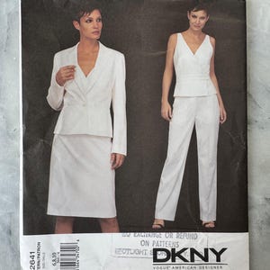May include: A white DKNY Vogue American Designer sewing pattern featuring a woman in a white skirt suit and another in white pants and a sleeveless top. The pattern number is 2641, with sizes 6, 8, and 10.