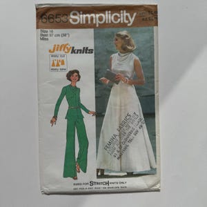 May include: Vintage Simplicity sewing pattern, size 16, featuring a green pantsuit and a white dress. The pattern includes "Jiffy Knits" and "easy cut" instructions. Bust size is 97 cm. The envelope has text from "Femina Fabrics".