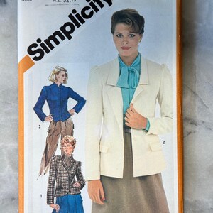 May include: Vintage Simplicity sewing pattern, size 10 Miss. The cover features a woman in a cream-colored blazer, teal blouse, and brown skirt. Additional illustrations show a blue jacket and a plaid blazer. The pattern includes the text "Simplicity".