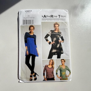 May include: A Vogue Patterns sewing pattern envelope V8817 by Katherine Tilton. The front displays four variations of a long-sleeved tunic top, labelled A, B, C, and D, featuring different colour schemes, patterns, and lengths, with a barcode at the top.