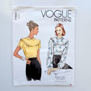 May include: Vogue Patterns V1809 sewing pattern envelope featuring two blouse designs. View A shows a solid yellow short-sleeve blouse with a collar. View B shows a long-sleeve blouse with a blue and green floral print. Text includes Reissue Circa 1947 Design.
