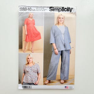 May include: Simplicity sewing pattern S8846 AA for sizes 10-18. The envelope features three garment variations: a coral v-neck dress, a floral print v-neck top, and a blue open-front jacket with matching wide-leg trousers. Includes text and branding.