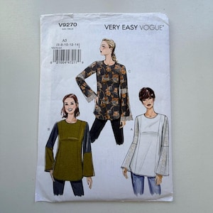 May include: A Very Easy Vogue sewing pattern, V9270, with three tunic designs. The pattern includes sizes A5 (6-8-10-12-14). The cover displays illustrations of the tunics in different colors and patterns.