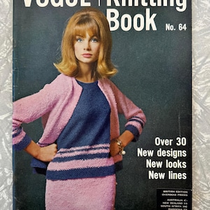 May include: A vintage Vogue Knitting Book No. 64 cover. It shows a woman in a pink knitted outfit with a navy blue top. The cover displays the text "VOGUE | Knitting Book" and details about new designs and looks.