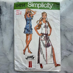 May include: A vintage Simplicity sewing pattern, number 9414, with illustrations of two dresses. The pattern details include "Miss Size 14 Bust 36" and "Jiffy easy cut-easy sew". The cover shows signs of wear.