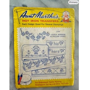 May include: A vintage Aunt Martha's Hot Iron Transfers packet. The yellow packet features blue floral designs for pillowcases, with the words "his" and "hers". The packet also includes text for embroidery, textile painting, and other art crafts.
