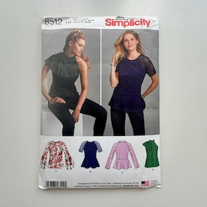 May include: Simplicity sewing pattern 8512 for women's tops. The pattern features images of various top designs, including a black top with a ruffled neckline and a navy top with mesh sleeves. The pattern includes sizes 6-14.