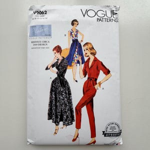 May include: Vogue Patterns sewing pattern featuring vintage designs from 1959. The package shows illustrations of three different outfits: a black patterned dress, a blue and patterned dress, and a red jumpsuit. The pattern is a reissue of the original design.