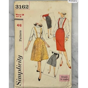May include: A vintage Simplicity sewing pattern, number 3162, with illustrations of skirts. The cover displays the text "Waist 28, Hip 38" and "Simple to make". The design features a colour palette of yellow, red, black, and white.