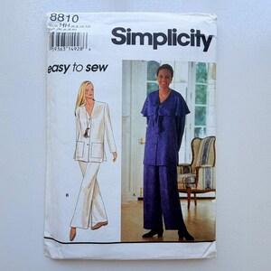 May include: Simplicity sewing pattern showing two women's outfits. The pattern includes a white trouser suit and a blue pyjama set. The text "easy to sew" is printed on the front of the pattern.
