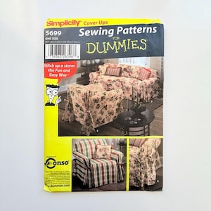 May include: A Simplicity 5699 sewing pattern envelope for cover-ups. The yellow and black packaging features illustrations of floral and plaid furniture slipcovers, the text Sewing Patterns for Dummies, and a barcode with the number 03936326396.