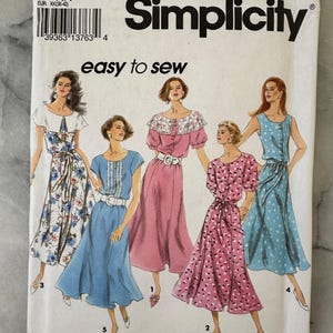 May include: A vintage Simplicity sewing pattern with illustrations of five dresses. The pattern number is 8290, and it includes sizes KK (8-14). The cover features the text "easy to sew" and "PATTERN/PATRON".