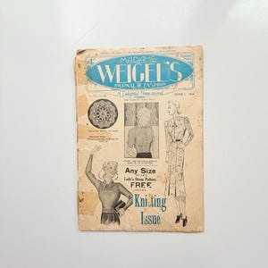 May include: A vintage Madame Weigel's Journal of Fashion magazine from June 1, 1928. The cover features a blue title, black and white illustrations of clothing, a crochet pattern, and text stating Any Size of this Lady's Dress Pattern Free.