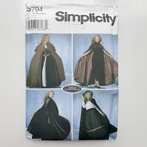 May include: A Simplicity 5794 sewing pattern envelope featuring illustrations of capes in sizes XS, S, M, and L. The cover displays four variations of capes worn over different outfits, with the text Teresa Nordstrom printed in an oval.