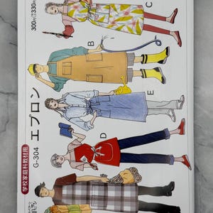 May include: A printed pattern sheet featuring apron designs. The aprons are shown in various styles and colors, including a yellow and white floral pattern, a solid tan, and a red apron. The text "G-304 エプロン" is visible.