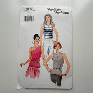 May include: A Very Easy Very Vogue sewing pattern, size 6-8-10, featuring illustrations of three different women's tops. The tops include a striped tank top, a one-shoulder top, and a halter top. The pattern is on a white background.