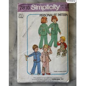May include: A vintage Simplicity sewing pattern, number 7816, for toddler clothing. The cover shows illustrations of children in outfits like a green floral suit, blue pajamas, and striped pajamas. The text "PERSONAL FIT PATTERN" is visible on the cover.