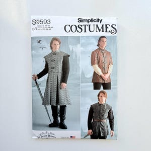 May include: Simplicity Costumes pattern S9593 featuring three variations of a tunic with a high collar and front closures. The envelope displays illustrations of individuals wearing these garments, including a long patterned tunic and two shorter versions, with text indicating U.S. sizes 46-52.