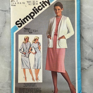 May include: Vintage Simplicity sewing pattern, size R (14, 16, & 18). The pattern features a woman in a pink dress and white jacket. The pattern number is 9832. The text on the pattern reads "Stretch Knit".