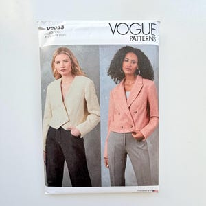 May include: Vogue Patterns V2053 sewing pattern envelope featuring two jacket styles. Style A is a cream textured cropped jacket with a single button. Style B is a coral double-breasted jacket with lapels and four buttons. Sizes R5 14-16-18-20-22.