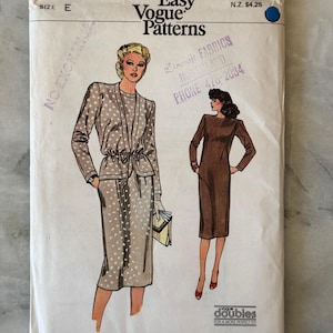 May include: Vintage Vogue Patterns sewing pattern envelope. The cover shows illustrations of two women in dresses. One is in a polka-dot suit, and the other is in a brown dress. The envelope has the text "Very Easy Vogue Patterns".