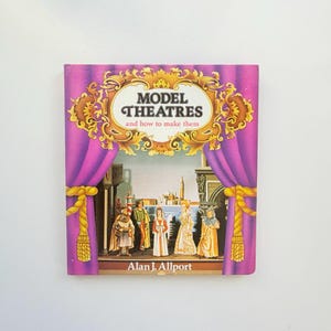 May include: A hardcover book titled Model Theatres and how to make them by Alan J. Allport. The cover features a purple curtain frame with gold trim, surrounding an illustration of four figures in historical clothing standing on a stage.