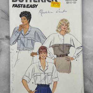 May include: Butterick pattern 4651, featuring illustrations of women's blouses. The cover displays the text "FAST & EASY" and "Madelein Ventes." The pattern includes various blouse styles with different sleeve lengths and details.