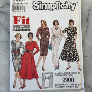 May include: Simplicity sewing pattern 9900, featuring illustrations of dresses. The pattern includes sizes OO (12-18). The cover displays the words "Fit and Fashion" and "Simplicity". The pattern includes two patterns: Fashion Dress and Plus Basic Fitting Pattern.