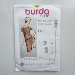 May include: A Burda Style sewing pattern envelope, number 7175, featuring a brown two-piece outfit with a short-sleeved top and skirt, a hat, and gloves. The white paper envelope displays technical line drawings, size charts, and text in multiple languages.