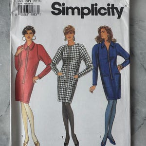 May include: Simplicity sewing pattern 7570 showing illustrations of three dresses in red, black and white check, and blue. The pattern size is NN (10-16) and EUR NN(38-44).