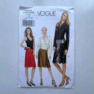 May include: Vogue pattern envelope showing fashion illustrations of three outfits. The envelope is white with the Vogue logo and pattern details. The pattern number is V8199, size D (12-14-16).