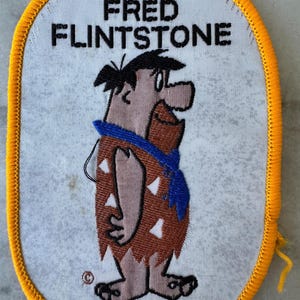 1980s Fred Flintstone Cartoon Patch - Oval Fabric Design with Yellow Border - Sew-On Appliqué