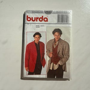 May include: A Burda sewing pattern packet featuring a red jacket and a plaid jacket. The packet includes the Burda logo in red, the pattern number 3932, and European sizes. The image shows two men modeling the jackets.