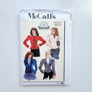 May include: A McCall's M8541 sewing pattern envelope for vintage 80s style jackets. The front features illustrations of four different jacket designs labelled A, B, C, and D, showcasing various sleeve lengths, collar styles, and button closures.