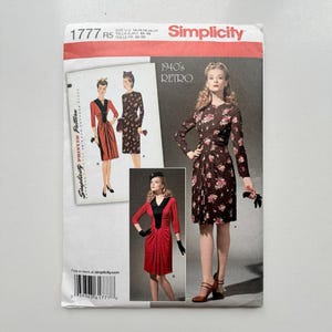 May include: Simplicity sewing pattern 1777 R5 for 1940s retro dresses. The envelope features illustrations of two dress styles: a long-sleeve floral print dress and a solid red dress with a black V-neck collar. Includes size US 14, 16, 18, 20, 22.
