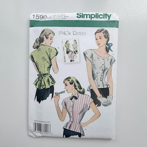 May include: A Simplicity 1590 sewing pattern envelope for 1940s retro tops. The white paper package features illustrations of three different blouse styles with short sleeves, peplum details, and button closures, displayed in green, white, and pink.