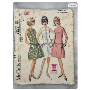May include: Vintage McCall's sewing pattern 7277 for misses' and junior dresses. The pattern features illustrations of three dresses in various styles, including a floral print, white, and pink dress. The pattern is marked "Easy to Sew."