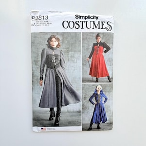 May include: Simplicity Costumes pattern S9813 for sizes 10-18. The envelope displays three garment variations: a grey coat with buckle details, a red dress with a black bodice, and a blue hooded dress with front lacing. Printed in the USA.