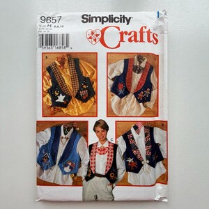 May include: Simplicity Crafts pattern packet featuring vest designs. The packet includes multiple vest variations with decorative elements like stars, moons, and patriotic themes. The packet has the number 9657 and size information.