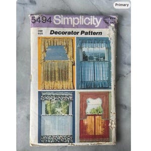 May include: Vintage Simplicity Decorator Pattern 5494. The cover displays four window curtain designs in diverse styles and colours. The top of the pattern is purple with the Simplicity logo and pattern number. The pattern is one size.