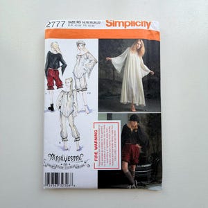 May include: Simplicity sewing pattern 2777 featuring various historical costume designs. The pattern includes illustrations of a long white dress, a black top with red shorts, and a white outfit. The pattern size is R5 14,16,18,20,22.