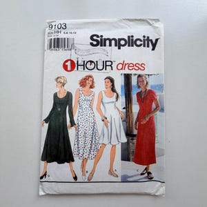 May include: Simplicity sewing pattern for a 1-Hour dress. The pattern envelope shows illustrations of four dress designs. The envelope is white with the text "Simplicity" and "1 Hour dress".