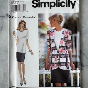 May include: A vintage Simplicity sewing pattern, showing illustrations of a skirt suit and a dress. The pattern cover includes the number 8217, size information, and the Damon Dress Inc. logo. The design includes a blazer with pink floral accents.
